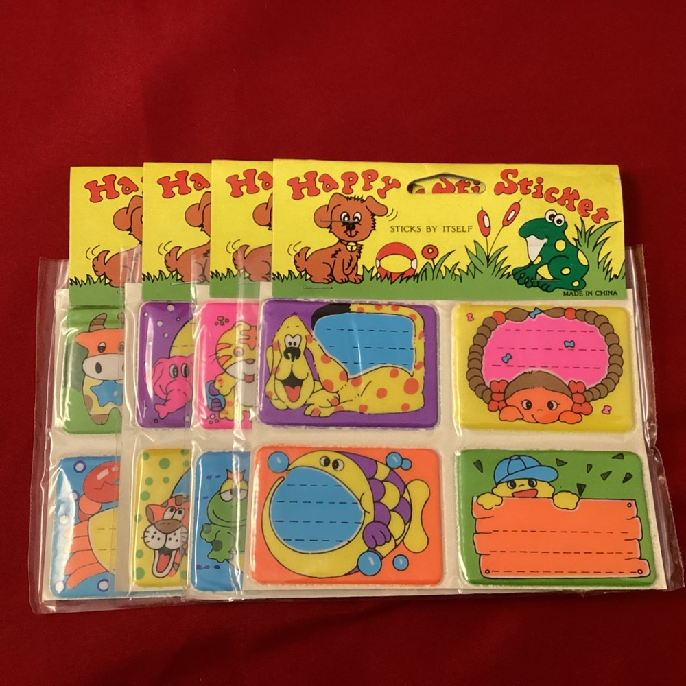 Pack of four sheets of vintage puffed Happy Sticker